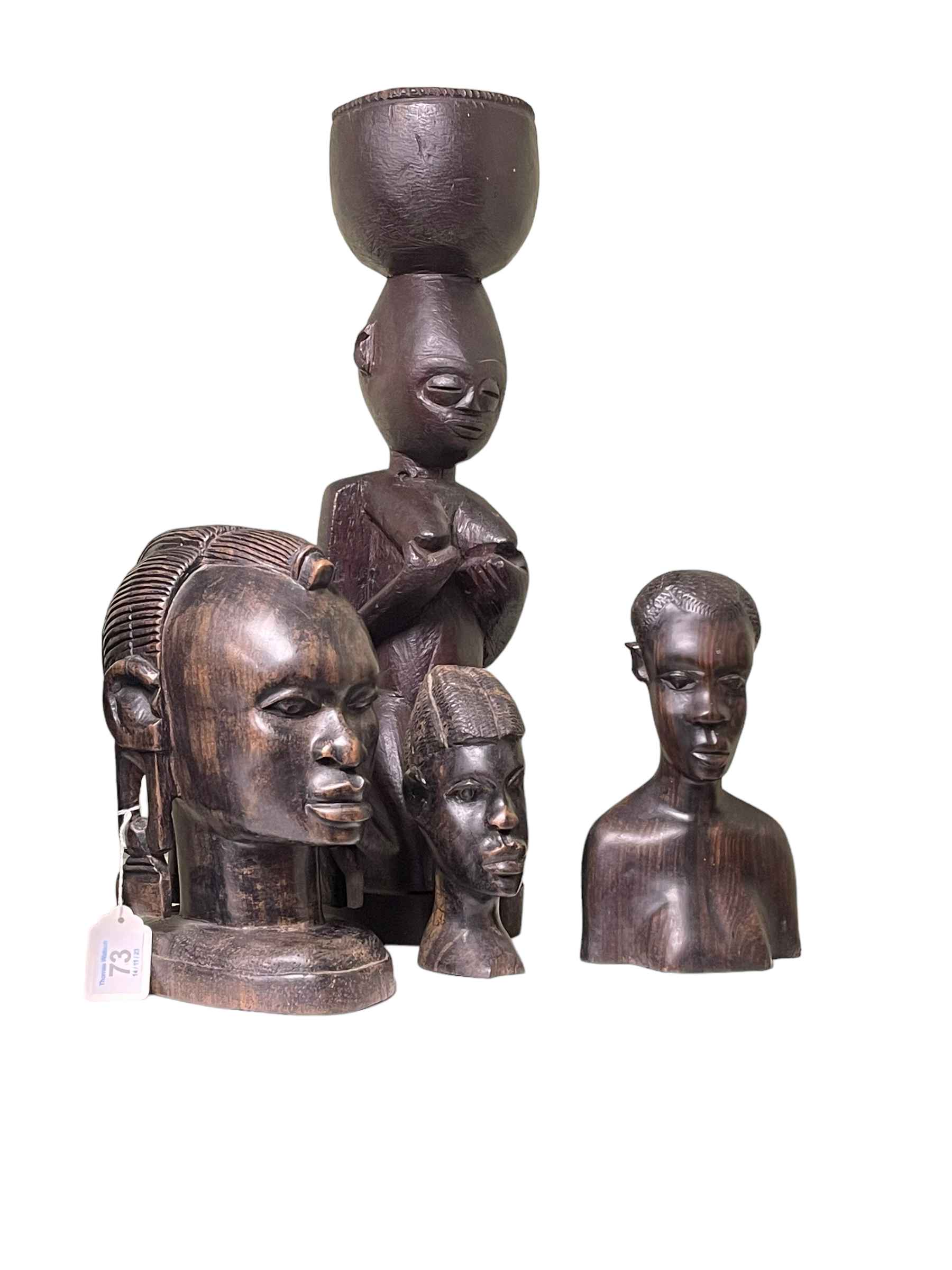 Tribal Fertility figure and three carved busts.