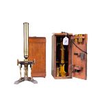 Victorian lacquered brass microscope by R&J Beck and another, both boxed.
