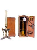 Victorian lacquered brass microscope by R&J Beck and another, both boxed.