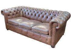 Millbrook tan deep buttoned leather three seater Chesterfield settee, 192cm by 71cm by 93cm.