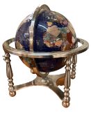 Semi-precious stone globe on chrome stand with box.