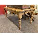 Rectangular pine turned leg kitchen table having frieze drawer, 77cm by 91cm by 183cm.