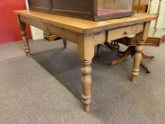 Rectangular pine turned leg kitchen table having frieze drawer, 77cm by 91cm by 183cm.