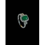 Emerald and diamond 18 carat white gold cluster ring, the rectangular emerald 1.