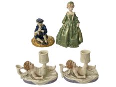 Two Royal Worcester cherub chamber candlesticks, Grandmothers Dress, and Seated Piper (4).