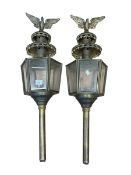 Pair of brass hexagonal coach lamps with eagle crests.