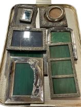 Collection of nine silver photograph frames.