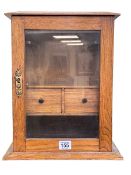 Oak glazed door smokers cabinet, 36cm.