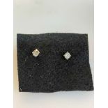 Pair of 18 carat white gold and diamond stud earrings, diamonds 0.51 carats.