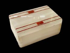 Aspreys 1920's alabaster and coral cigarette box with silver hinge, 15cm across.