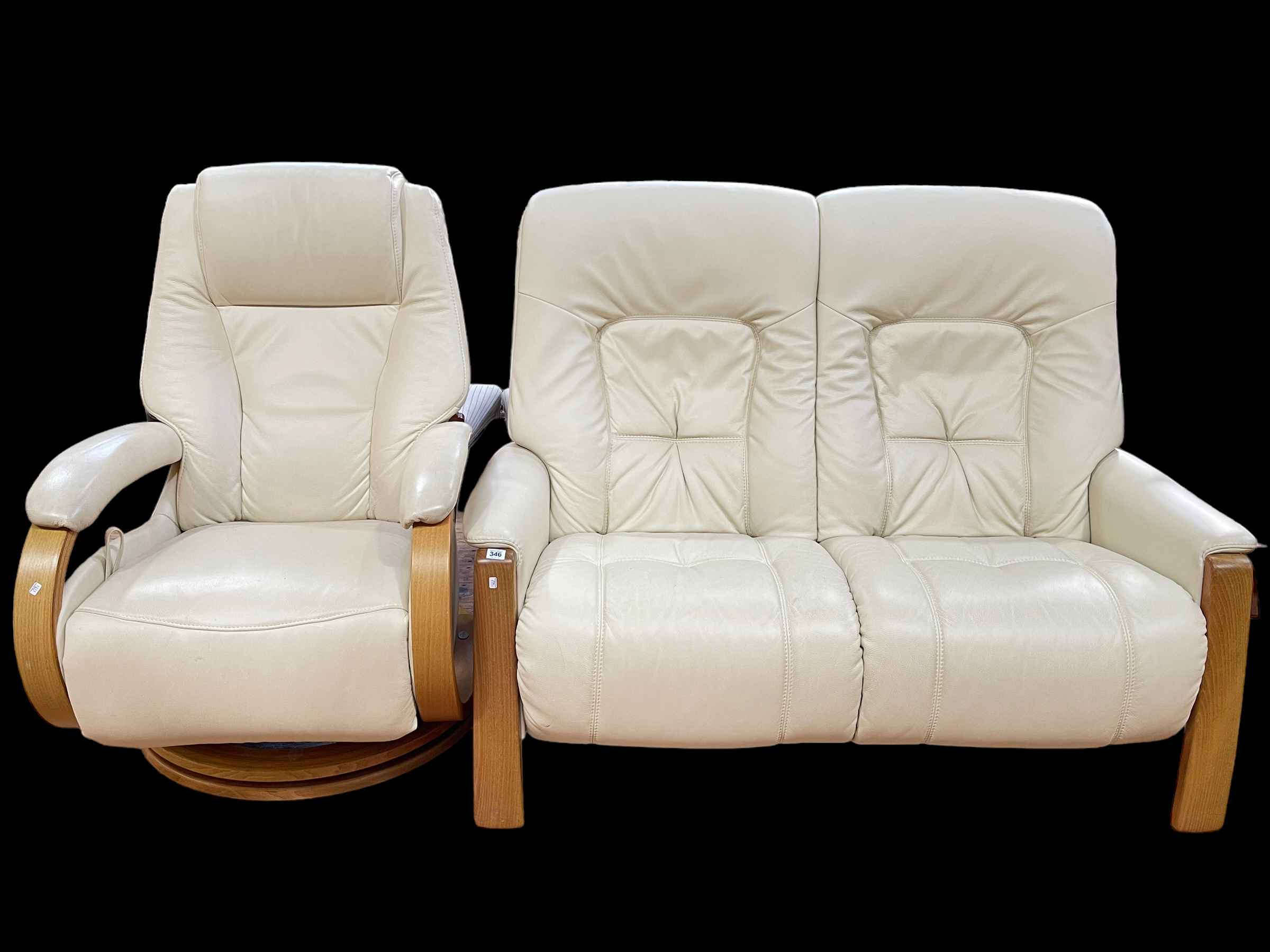 Himolla leather two seater settee and reclining chair.