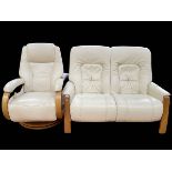 Himolla leather two seater settee and reclining chair.