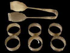 Pair silver tongs, Sheffield 1912, and set of six silver napkin rings (7).