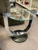 Contemporary circular glass, chrome and black occasional table, 60.5cm by 56cm diameter.