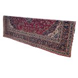 Large hand made wool pile Kashan carpet with classic floral central medallion design, 3.90 by 3.00m.