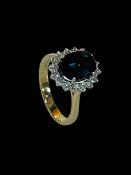Large oval sapphire and diamond cluster ring, the central sapphire 3.
