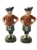 Two pottery Scotsman figures, 36cm.
