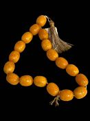 Amber colour large bead necklace.