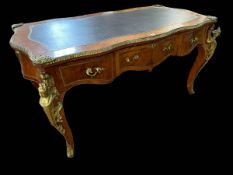 Louis XV style brass mounted three drawer French bureau plat of serpentine form,