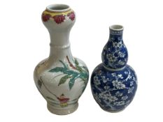 Two Chinese vases, one with famille rose decoration, tallest 23cm.