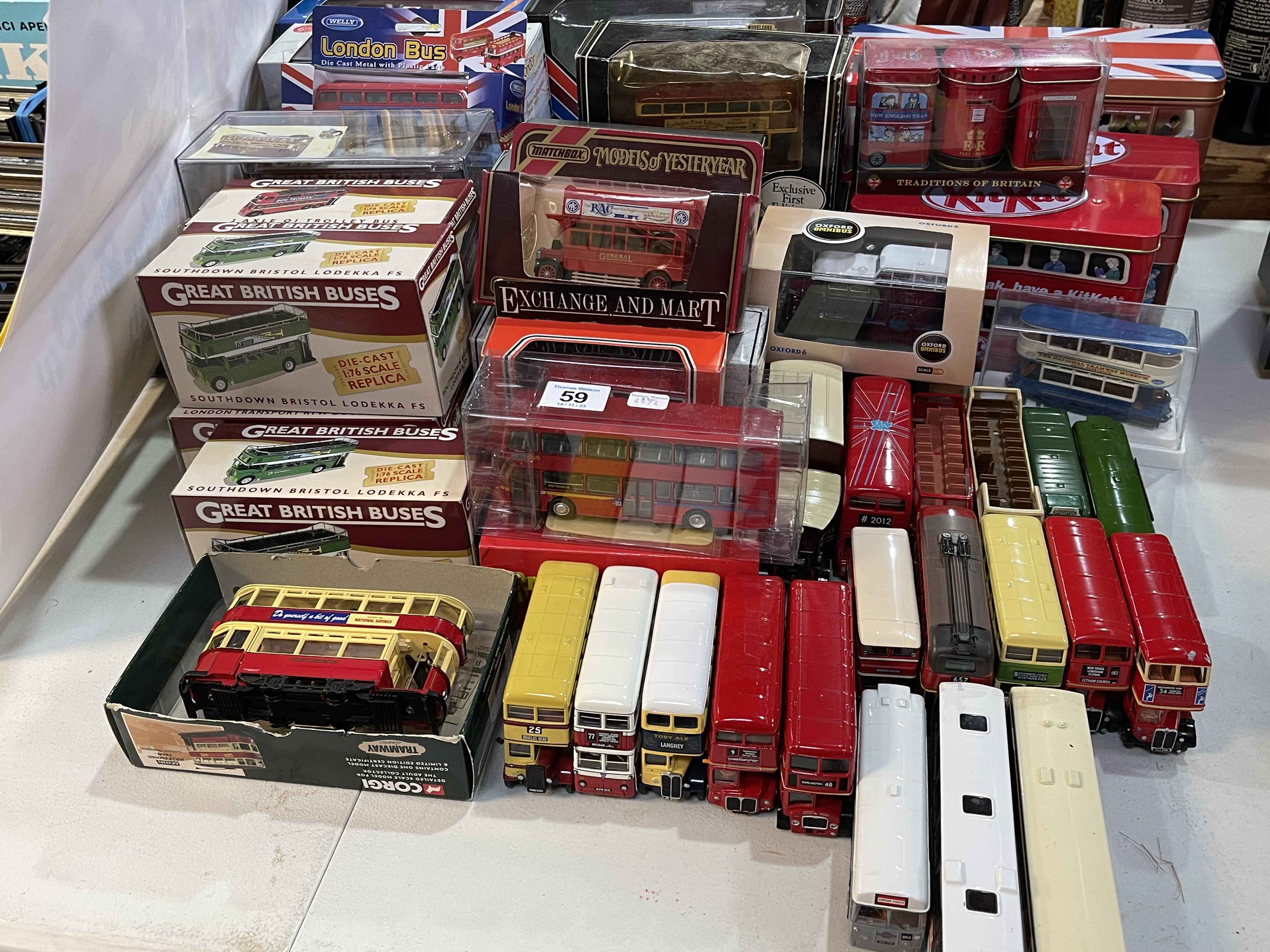 Collection of model buses, boxed and loose.