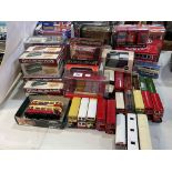 Collection of model buses, boxed and loose.