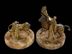 Two bronzed figures of matadors and bulls on onyx stands.