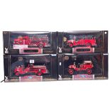 Four Road Signature Models of American Fire Trucks each with 24k gold plated coin, boxed as new.