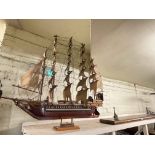 Large model of a sailing galleon with wall shelf.