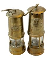 Two miners lamps, CYMRU, and Protector Type 6.