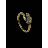 18 carat yellow gold and platinum set three stone diamond ring, size K.