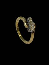 18 carat yellow gold and platinum set three stone diamond ring, size K.