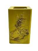 Chinese yellow ground square form brush pot decorated with raised tree and village and verse scenes,