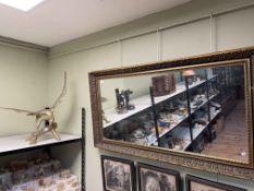 Rectangular gilt framed wall mirror and brass eagle on branch.