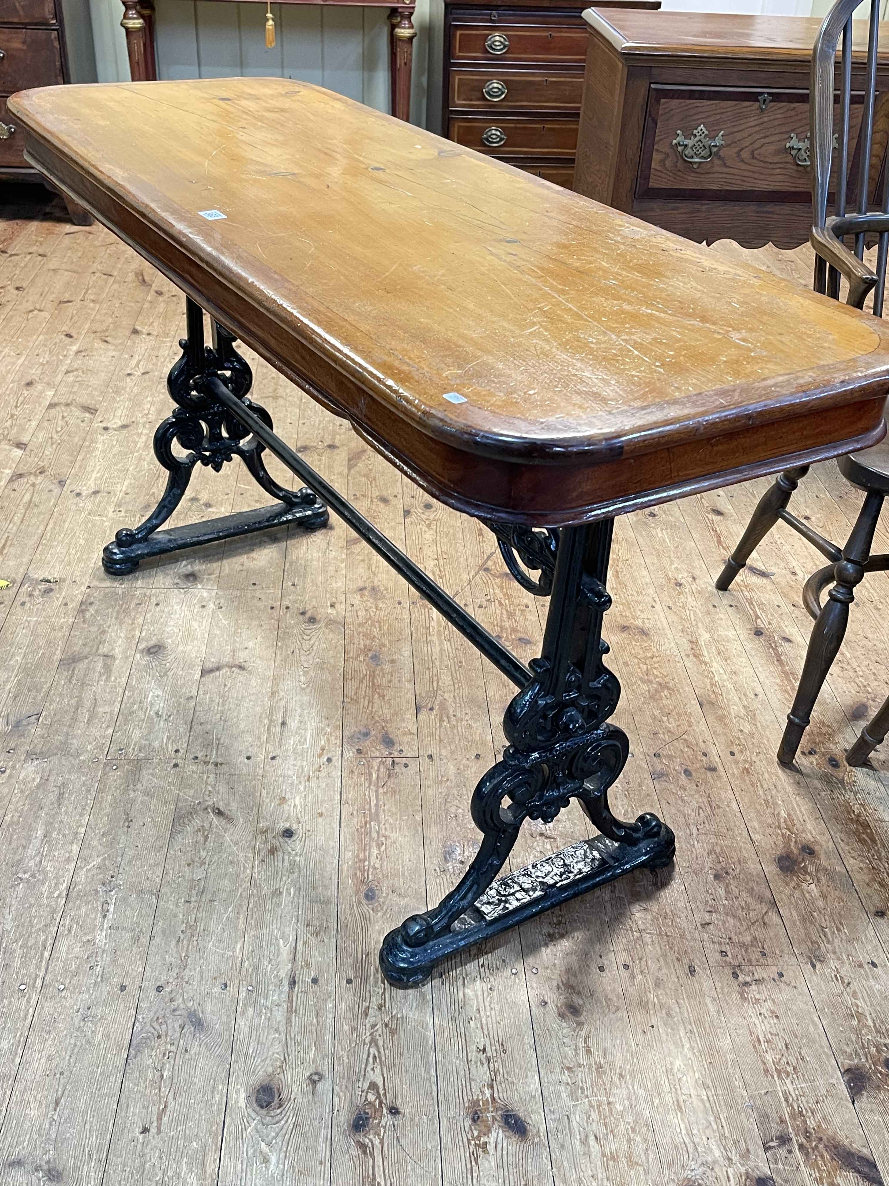 Cast base rectangular pub table, 79cm by 145cm by 53cm.