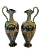 Pair Royal Doulton stoneware ewers, 29cm.