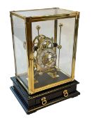 Dent 1769 London replica skeleton clock under gilt brass glazed case, 34cm high, 24cm by 10cm base.