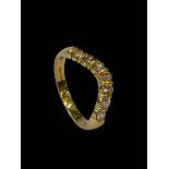 Seven stone diamond wishbone design ring set in 18 carat yellow gold, size S.