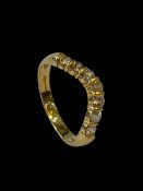 Seven stone diamond wishbone design ring set in 18 carat yellow gold, size S.