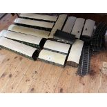 Collection of wooden railway carriages, wagons and track.