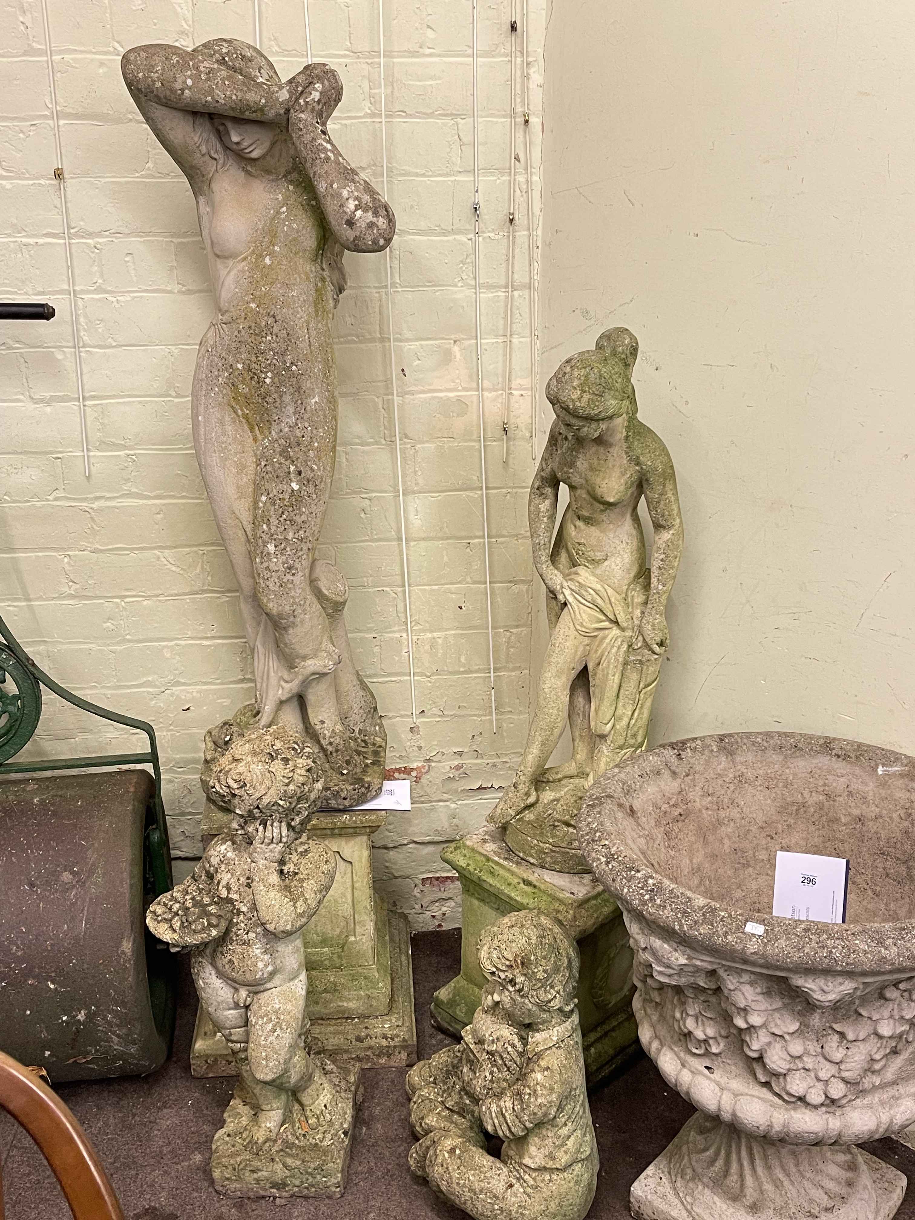 Four weathered garden figures, two on plinths, largest 162cm including plinth.
