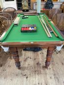 6ft by 3ft snooker table on turned leg stand with accessories including cues, rests, set of ball,