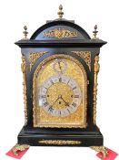 Large 19th Century gilt mounted ebony bracket clock with striking movement and matching wall
