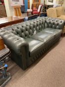 Green deep buttoned leather three seater Chesterfield settee.