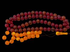 Two sets of cherry and yellow amber beads, 198 grams.