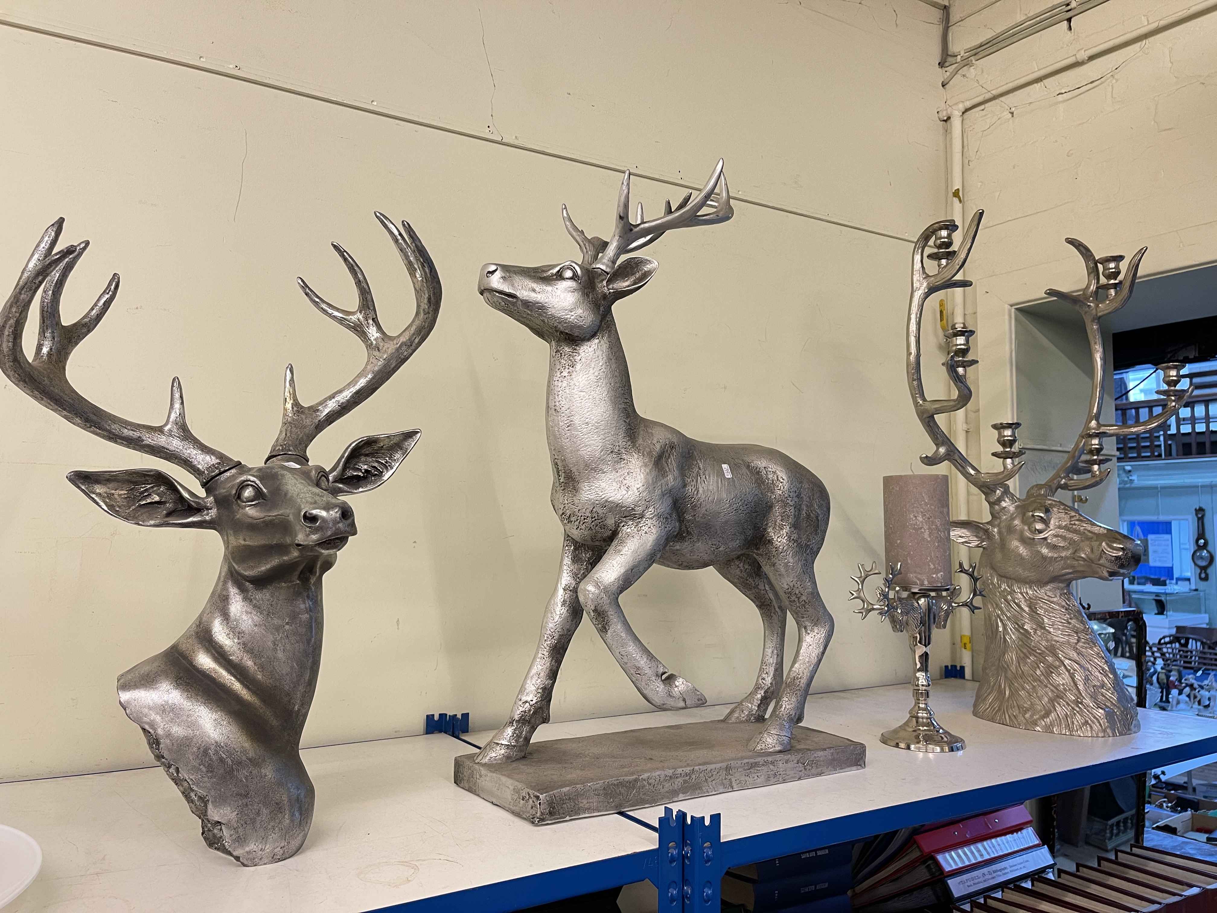 Large silvered stag, stag bust and two stag candle holders.