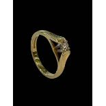 18 carat yellow gold and 0.20 carat diamond solitaire ring, size N.