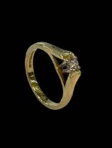 18 carat yellow gold and 0.20 carat diamond solitaire ring, size N.