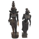 Pair of carved figures of Indian ladies in traditional dress.