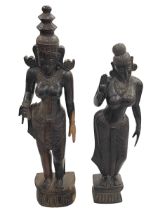 Pair of carved figures of Indian ladies in traditional dress.